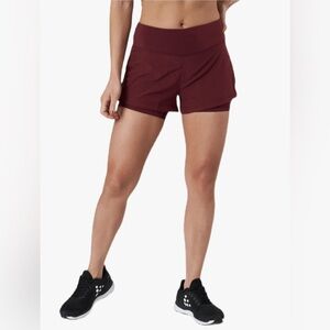 Craft Women's Maroon ADV Essence 2-in-1 Shorts. Size medium.